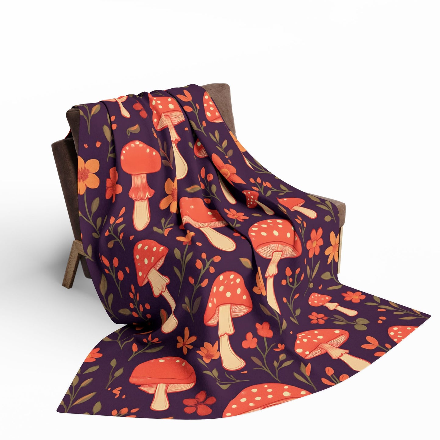 Cozy Mushroom Blanket, The enchanting mushroom pattern, set against a rich plum throw, turns any sofa into an autumnal paradise.