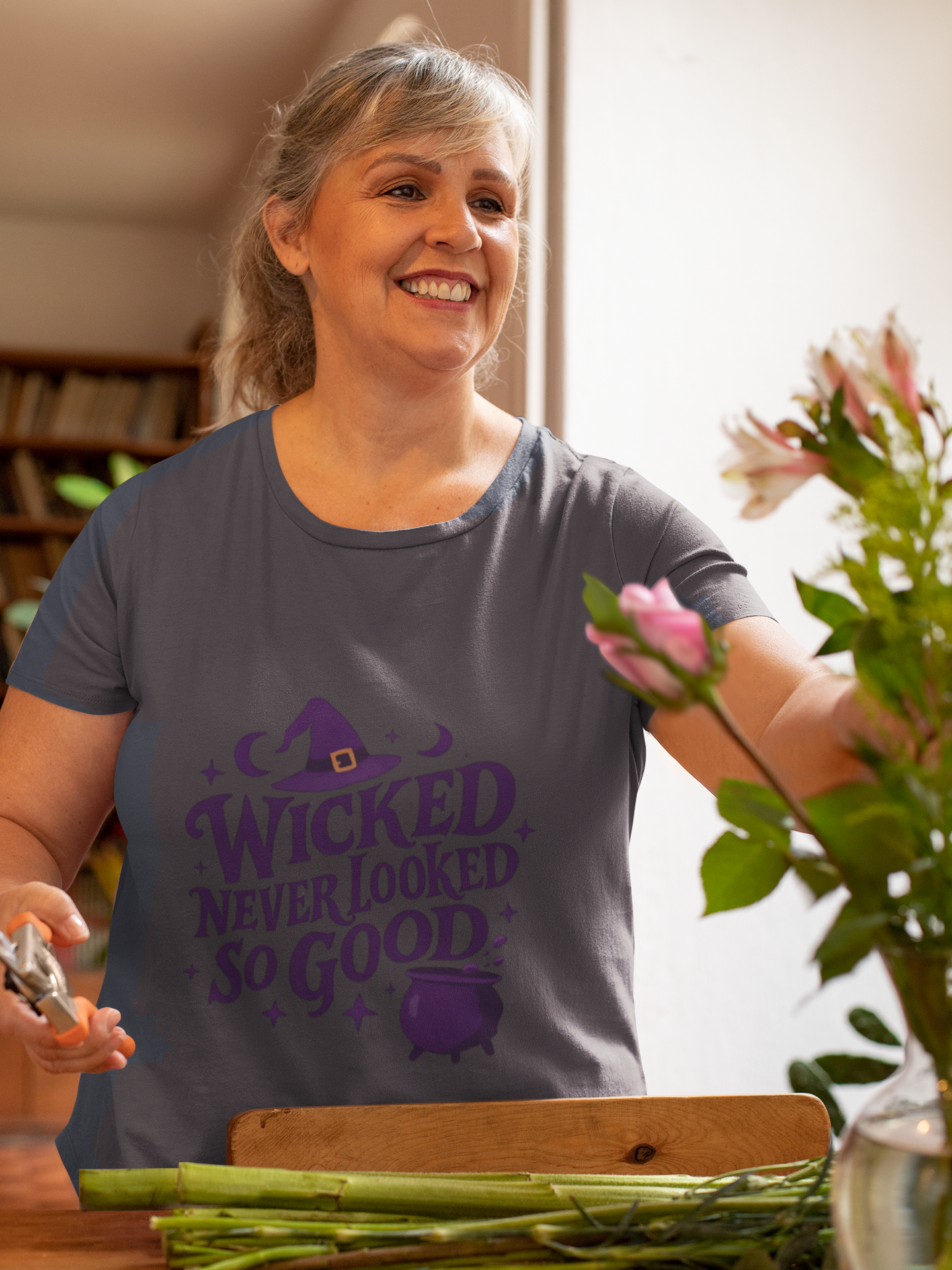 Wicked Never Looked So Good T-Shirt, a spellbinding addition to any witchy wardrobe, embodying the mischievous charm of witchcraft.