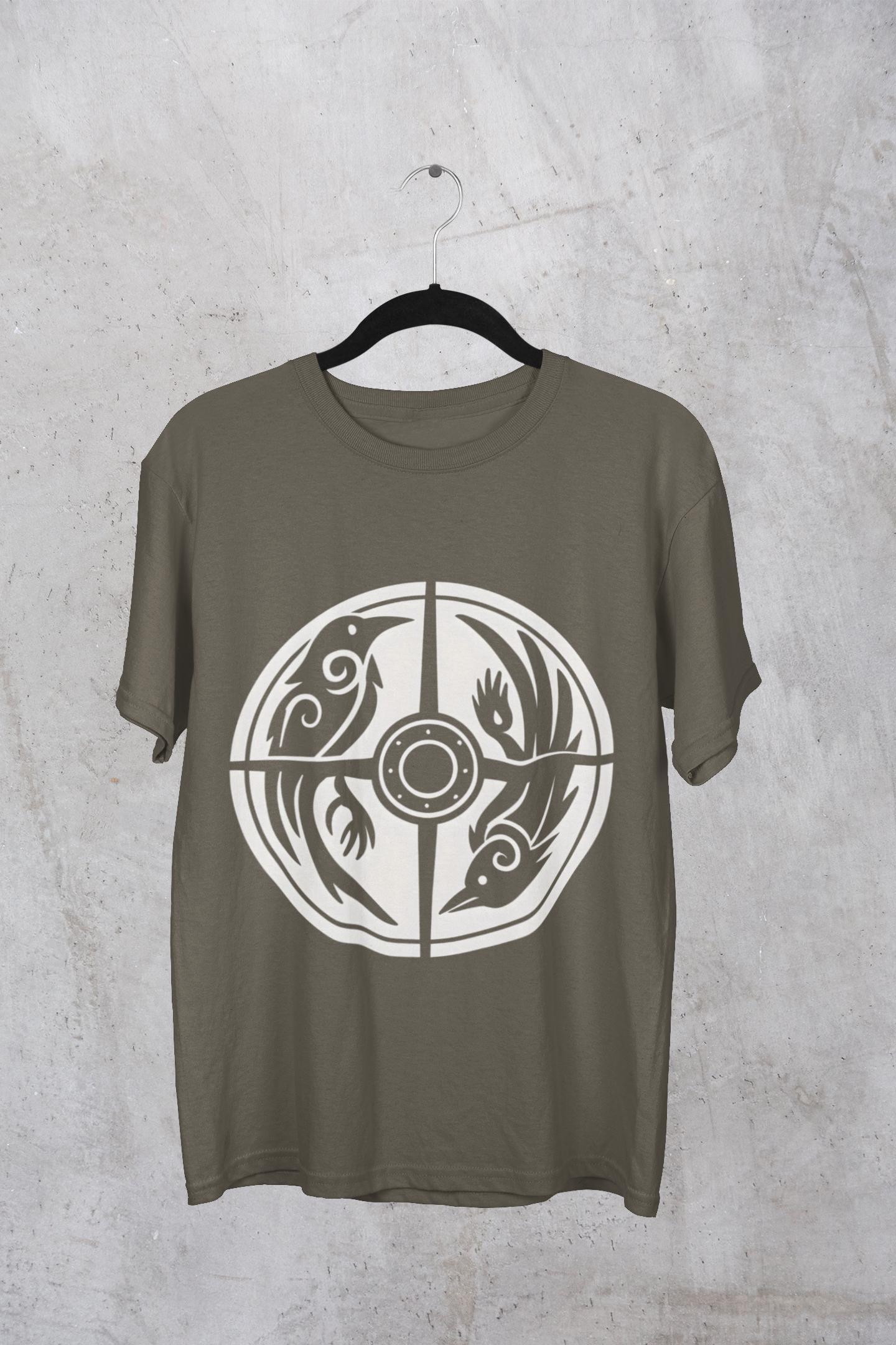 Norse Raven Shield T-shirt, Embrace the spirit of ancient warriors, an essential piece for any lover of Viking apparel.