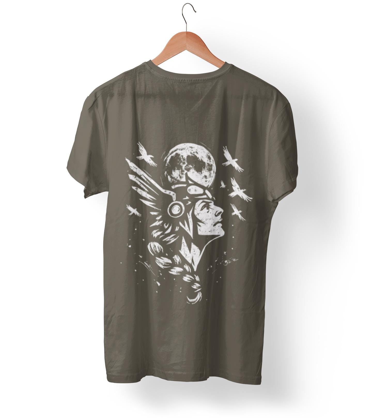 Valkyrie Norse Pagan T-Shirt, is a tribute to the powerful legends of old. Embrace the spirit of the Valkyrie with this striking design that merges the mystique of norse mythology with the rugged appeal of viking apparel.