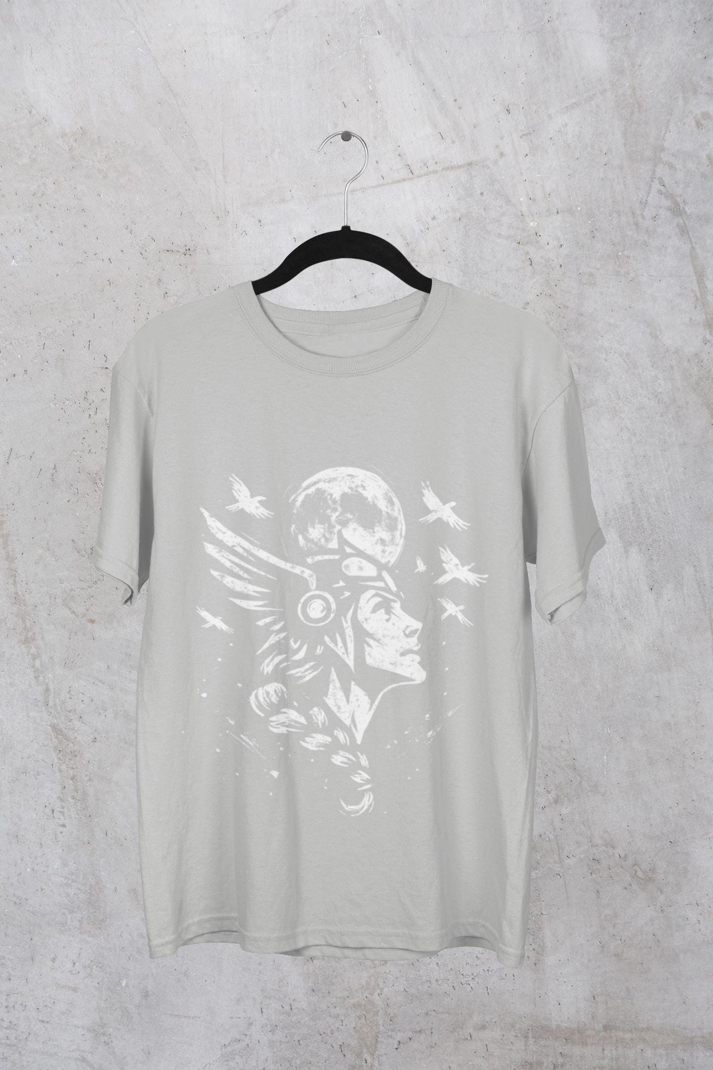 Valkyrie Norse Pagan T-Shirt, is a tribute to the powerful legends of old. Embrace the spirit of the Valkyrie with this striking design that merges the mystique of norse mythology with the rugged appeal of viking apparel.