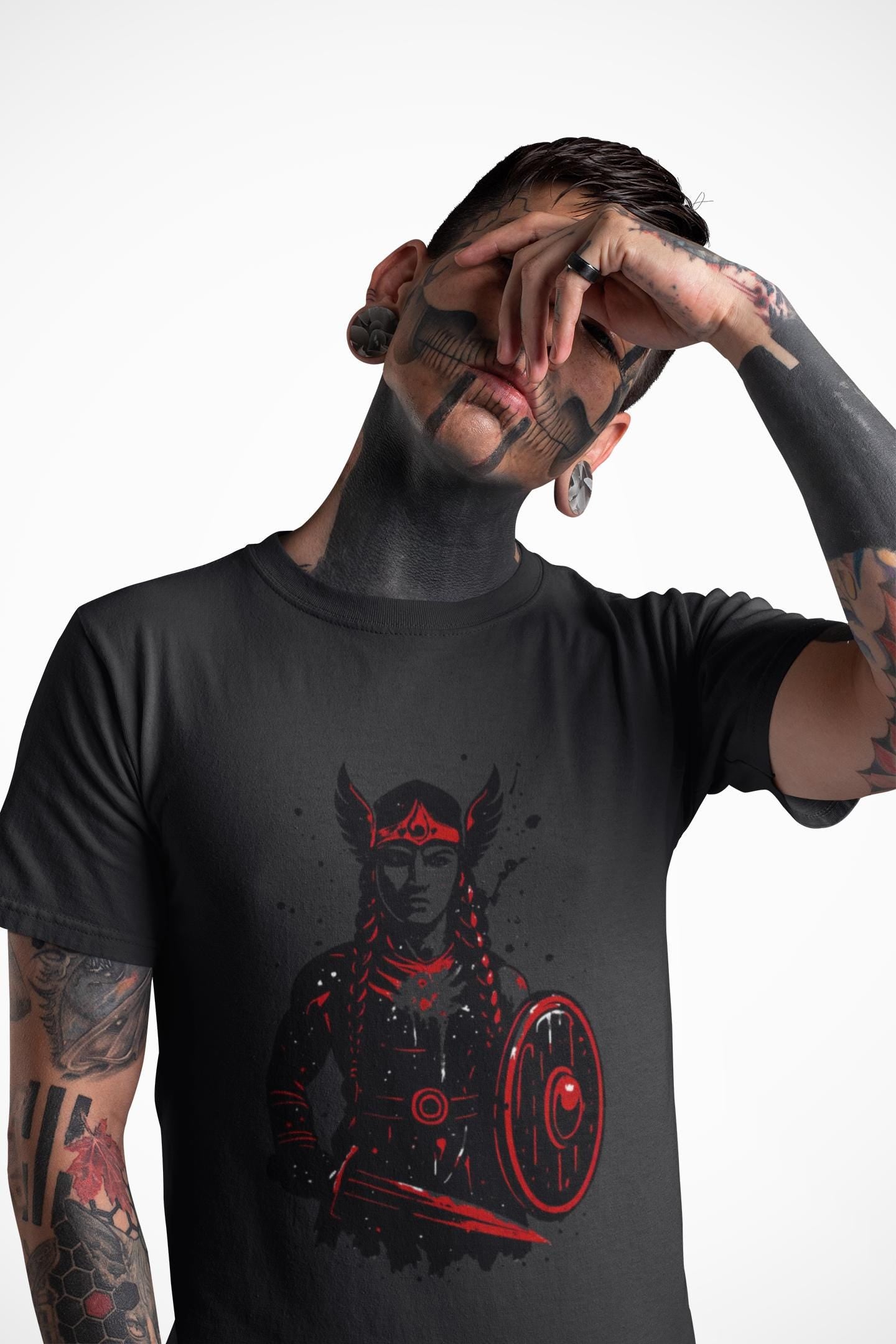Valkyrie Norse Pagan T-Shirt, a tribute to the powerful legends of old. Embrace the spirit of the Valkyrie with this striking design that merges the mystique of norse mythology with the rugged appeal of viking apparel.