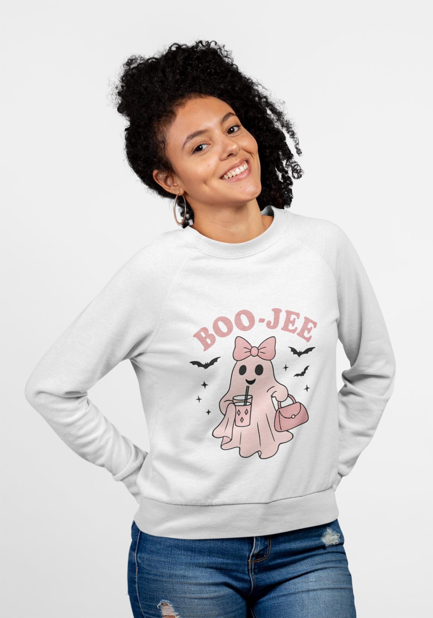 Boo-Jee Ghost Sweatshirt This playful garment, affectionately known as the boojee sweater, showcases charming ghosties adorned with a delightful pink bow.