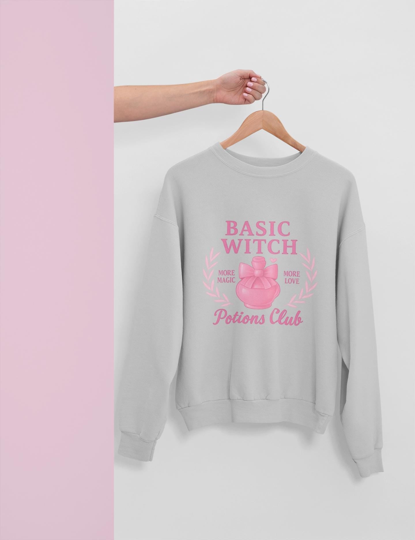 Basic Witch Potions Club Sweatshirt, This witchy sweatshirt exudes autumnal charm with its soft fabric that’s perfect for sweater weather, and features a whimsical potion bottle design reminiscent of a witches brew.