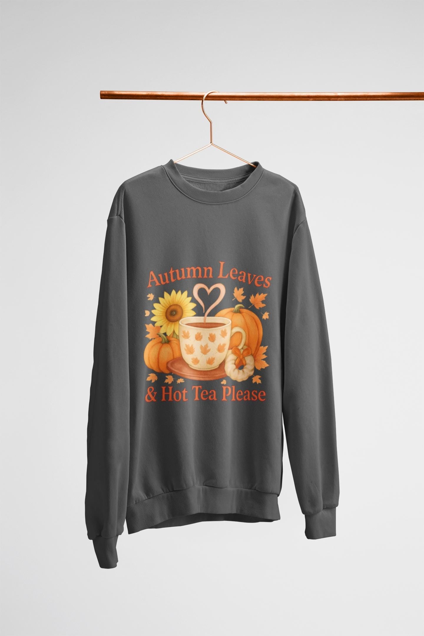 Autumnal Leaves and a Cup of Tea Sweatshirt, Imagine sipping on a warm cuppa, perhaps a delightful Yorkshire tea in a comfortable sweater.
