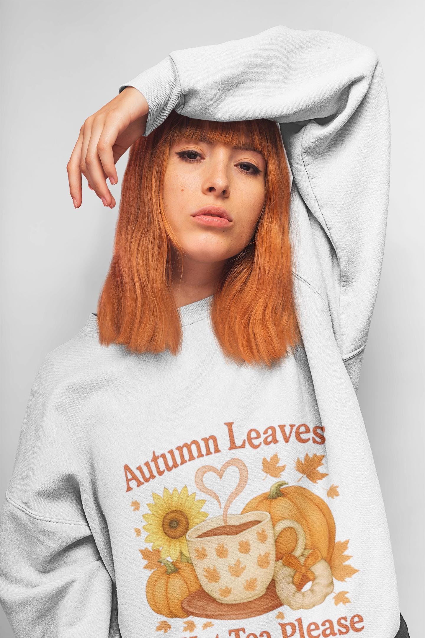 Autumnal Leaves and a Cup of Tea Sweatshirt, Imagine sipping on a warm cuppa, perhaps a delightful Yorkshire tea in a comfortable sweater.
