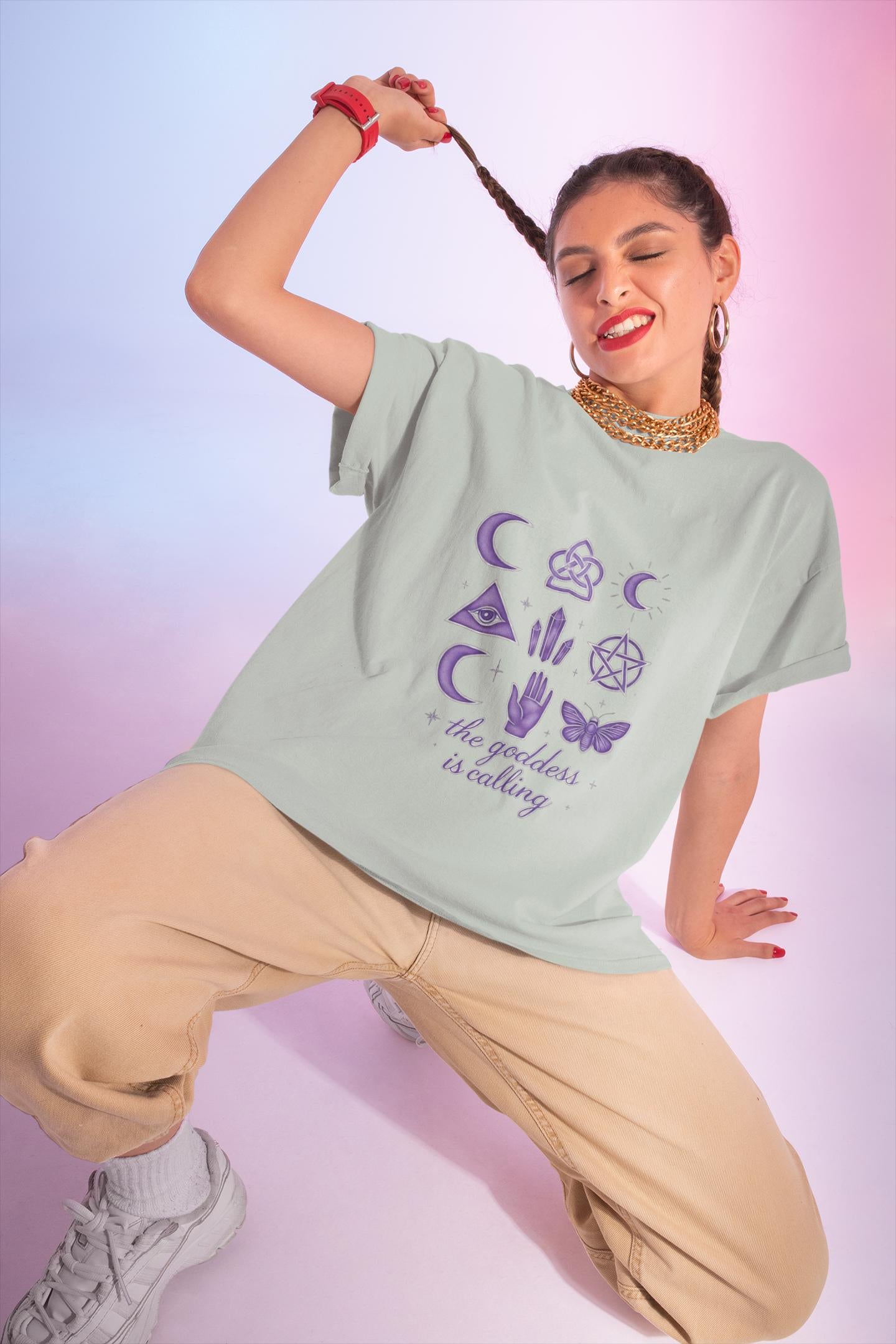 The Goddess is Calling Shirt, a celebration of divine feminine energy, seamlessly blending style and spirituality.