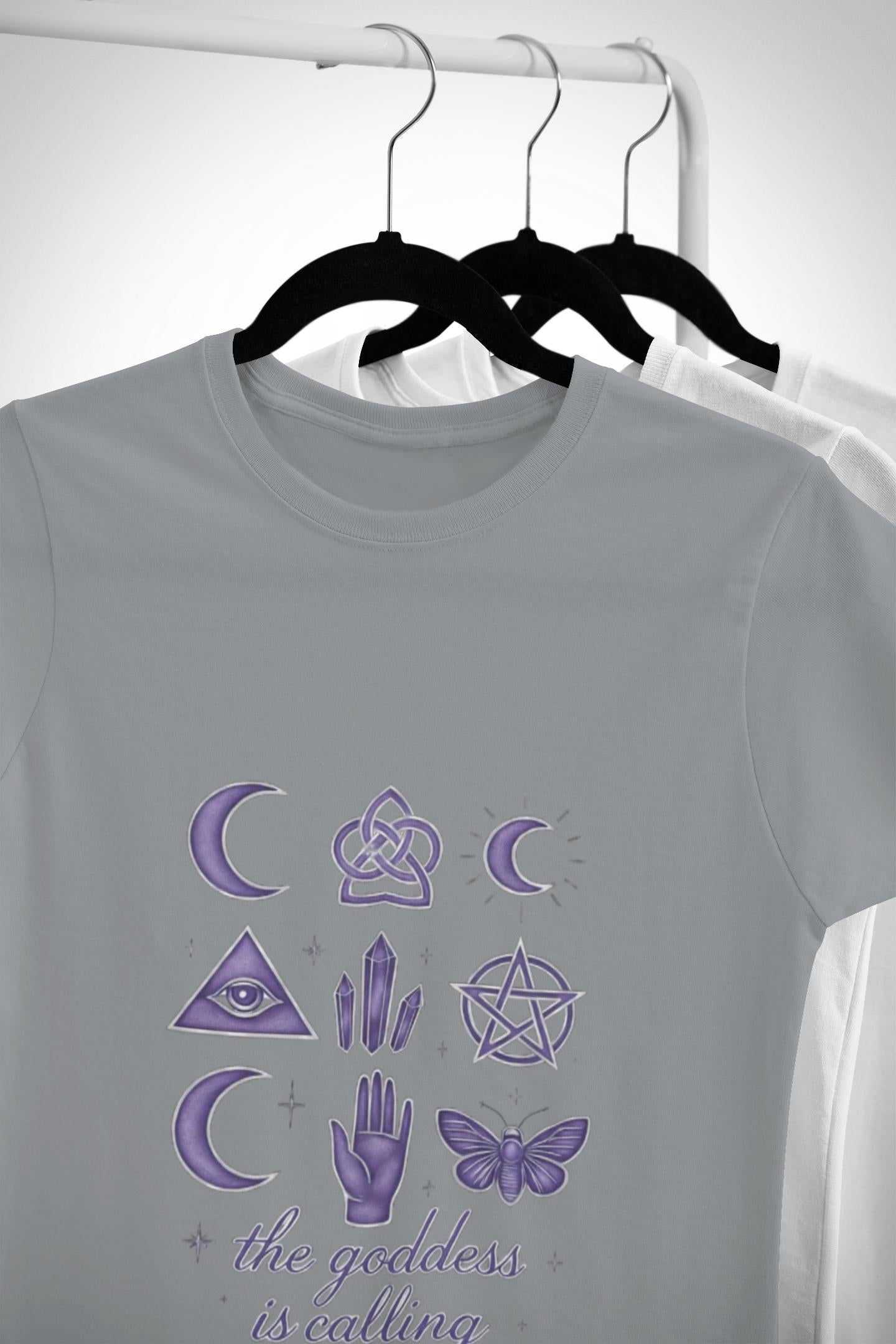 The Goddess is Calling Shirt, a celebration of divine feminine energy, seamlessly blending style and spirituality.