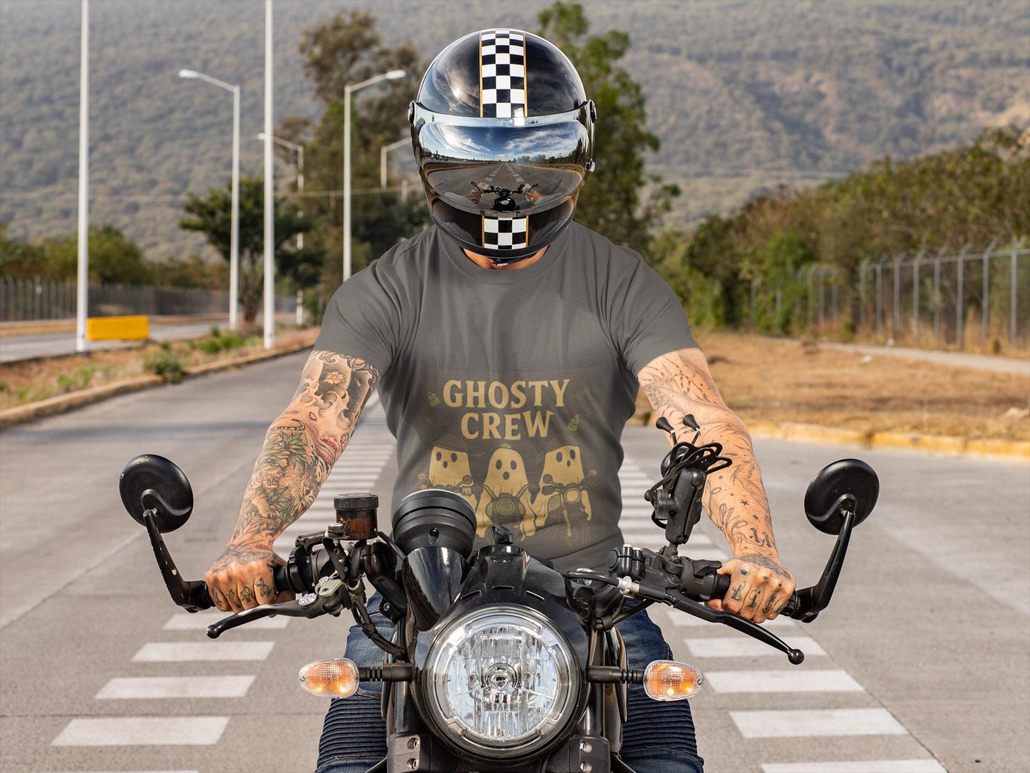 Halloween Ghosty Tee Ghost biker tee, perfect for showing off your fun and playful spirit! This tee boasts a vibrant design featuring ghostly charactersriding bikes.