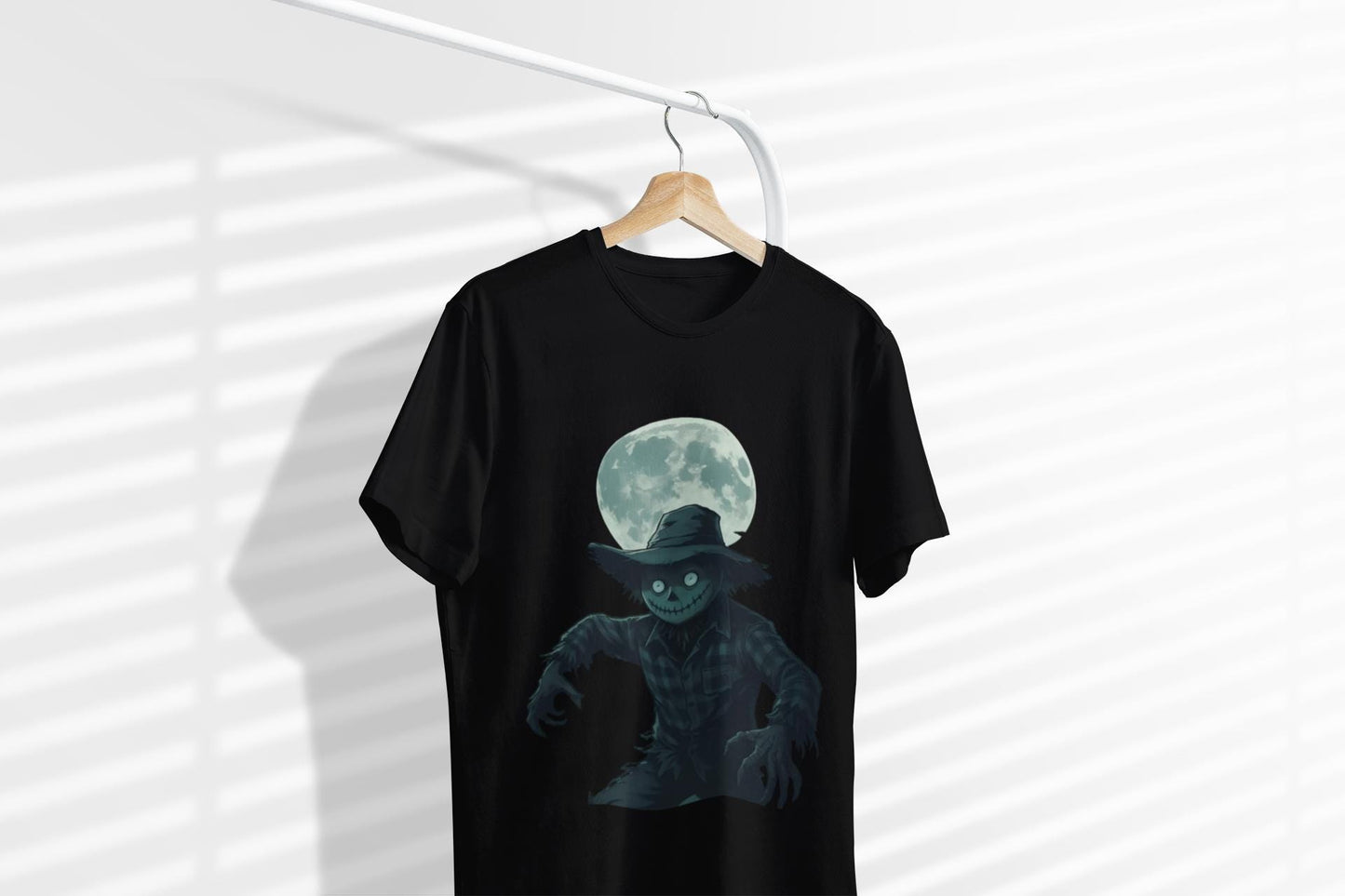 Halloween Scarecrow T-Shirt, This scarecrow shirt captures the essence of the season, transforming the traditional harvest icon into a pumpkin scarecrow that’s both captivating and chilling.Halloween