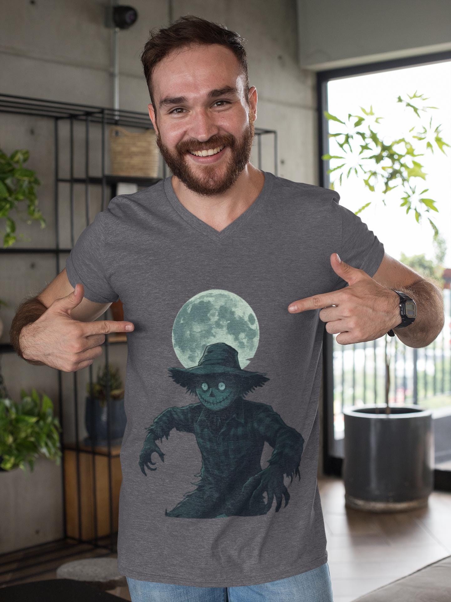 Halloween Scarecrow T-Shirt, This scarecrow shirt captures the essence of the season, transforming the traditional harvest icon into a pumpkin scarecrow that’s both captivating and chilling.Halloween