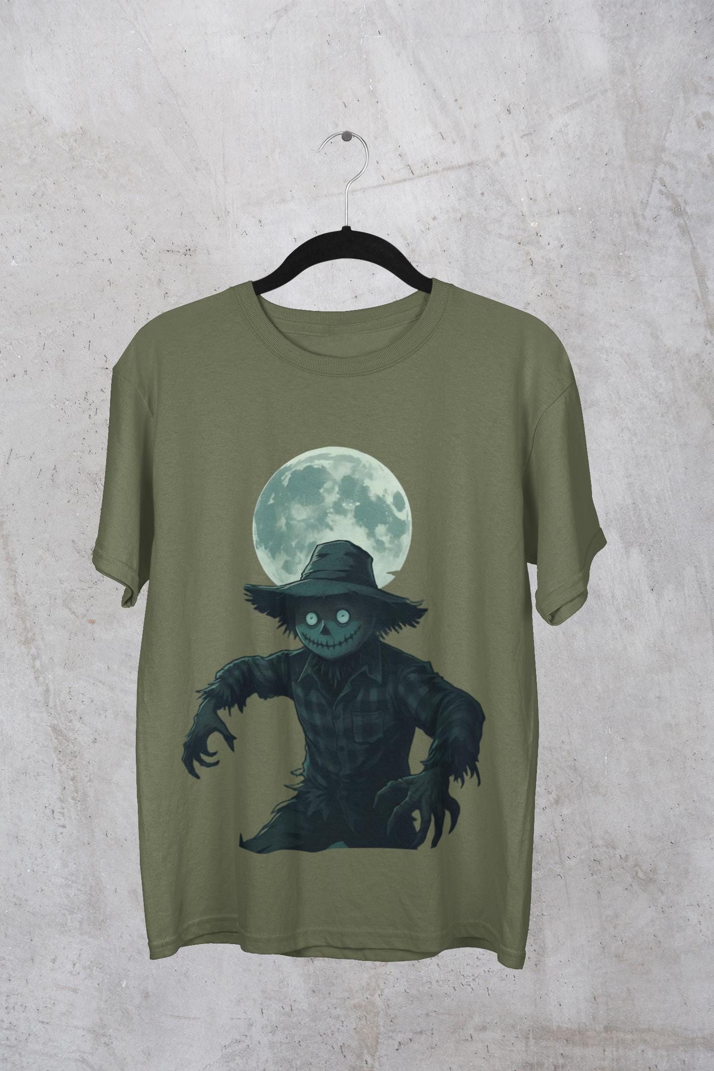Halloween Scarecrow T-Shirt, This scarecrow shirt captures the essence of the season, transforming the traditional harvest icon into a pumpkin scarecrow that’s both captivating and chilling.Halloween