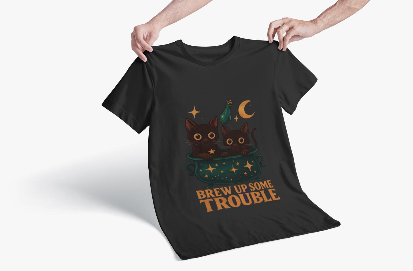 Brew Up Some Trouble Cat Witchy T-shirt, The seamless blend of mystical charm and humor makes this shirt a must-have for any lover of cute Halloween cat apparel.
