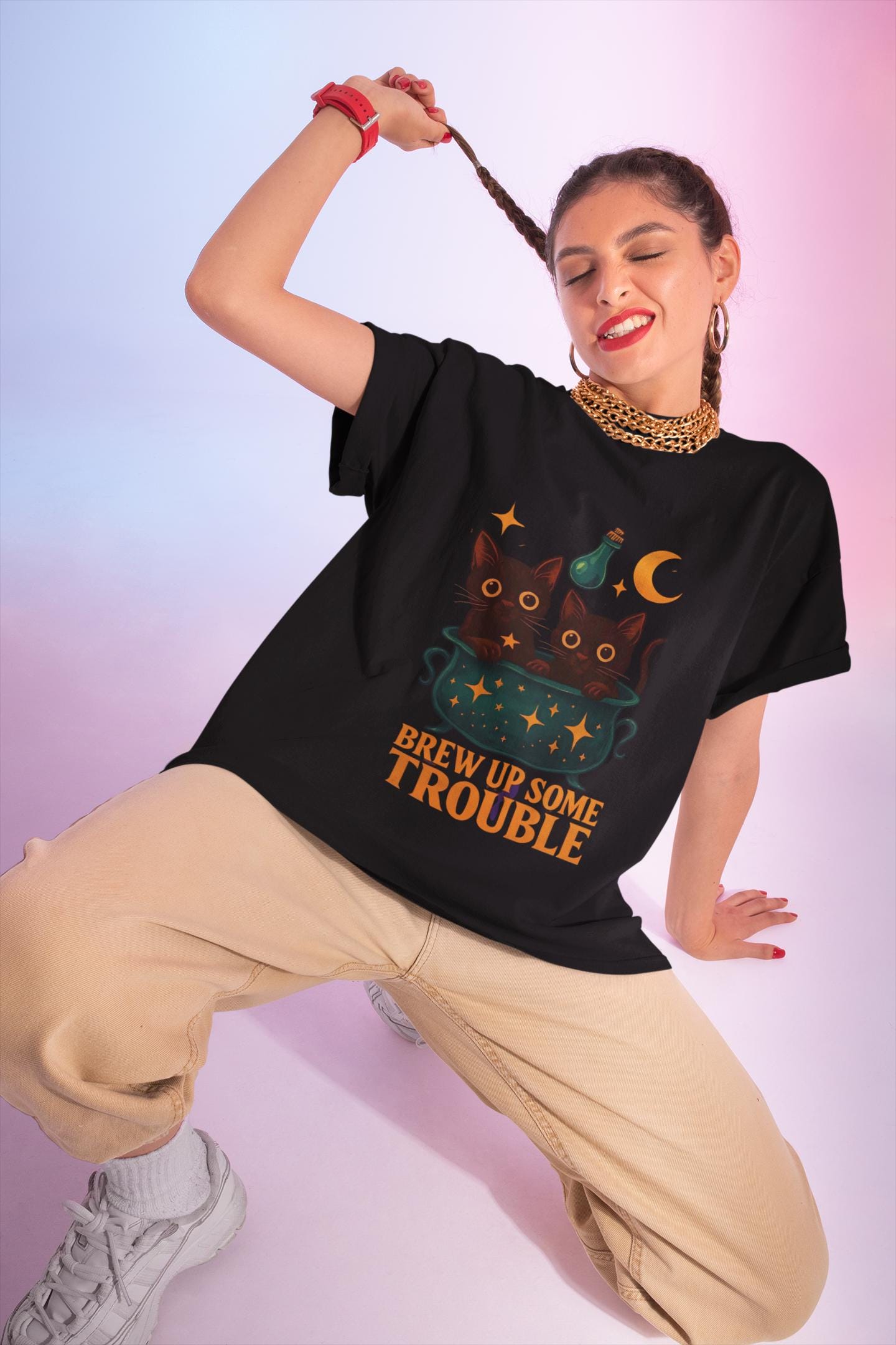 Brew Up Some Trouble Cat Witchy T-shirt, The seamless blend of mystical charm and humor makes this shirt a must-have for any lover of cute Halloween cat apparel.
