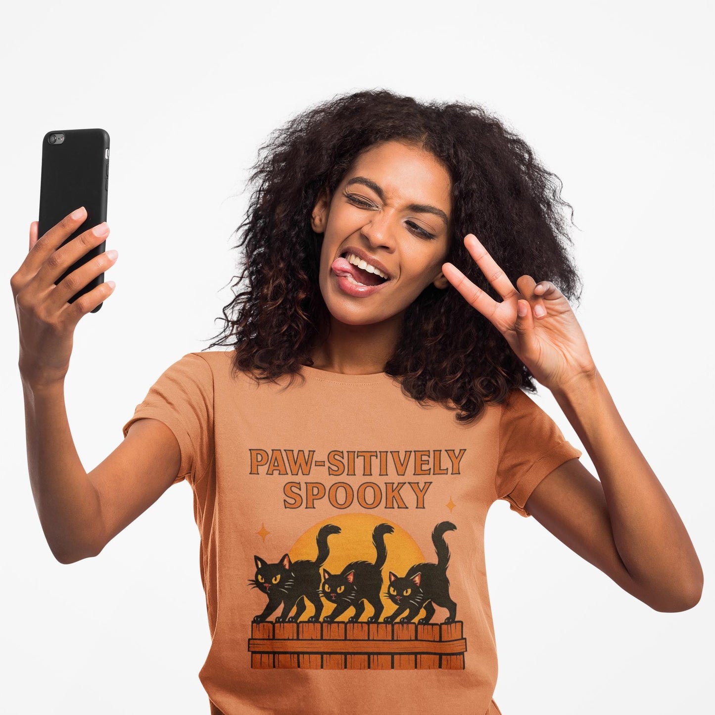 Paw-sitively Spooky Cat Tshirt, Whether you're a devoted cat dad or gifting it to a feline-loving friend, this cute Halloween cat apparel spreads pawsitive vibes with its blend of spooky black cats and cheeky charm.
