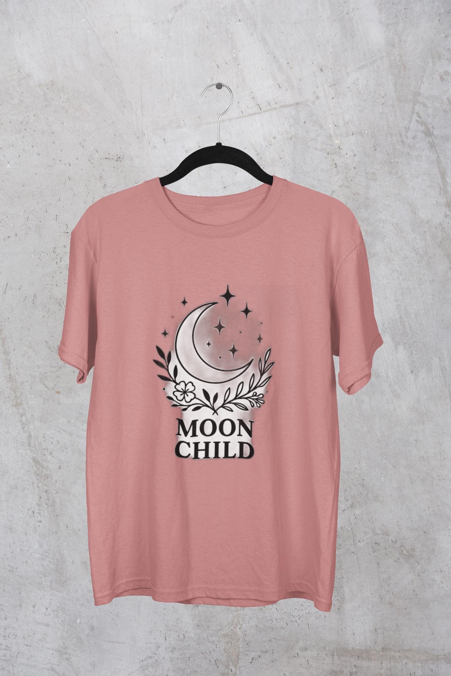Moon Child T-Shirt, Crescent Moon Shirt, this moon child tee is more than just a piece of pagan clothing—it's a magical shirt that invites the wearer to explore the enchanting world of witchy things.