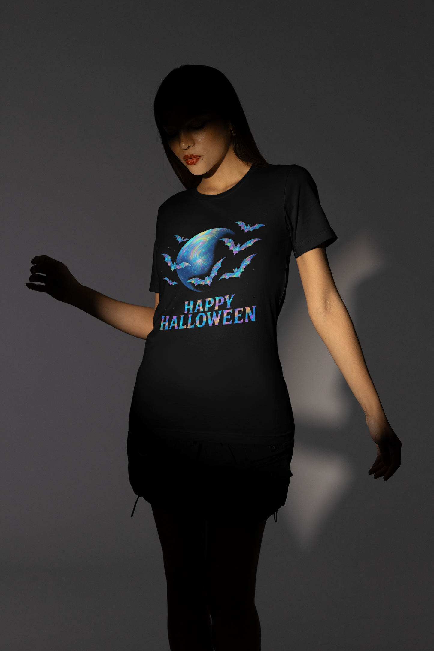 Happy Halloween Holographic style Bat Tshirt, It's a fusion of art and fashion—a masterpiece of holographic art that transforms a simple bat shirt into a standout piece.
