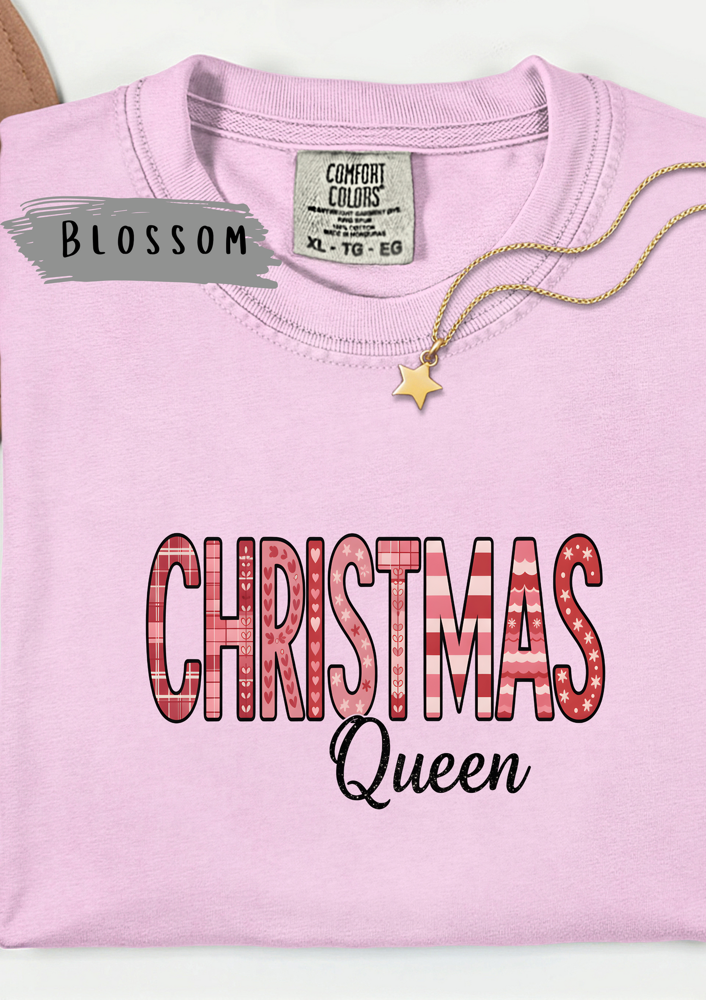 Christmas Queen Pinkmas T-shirt,this pink Christmas tee offers unparalleled comfort, making it a fabulous holiday graphic tee for all your festive activities.