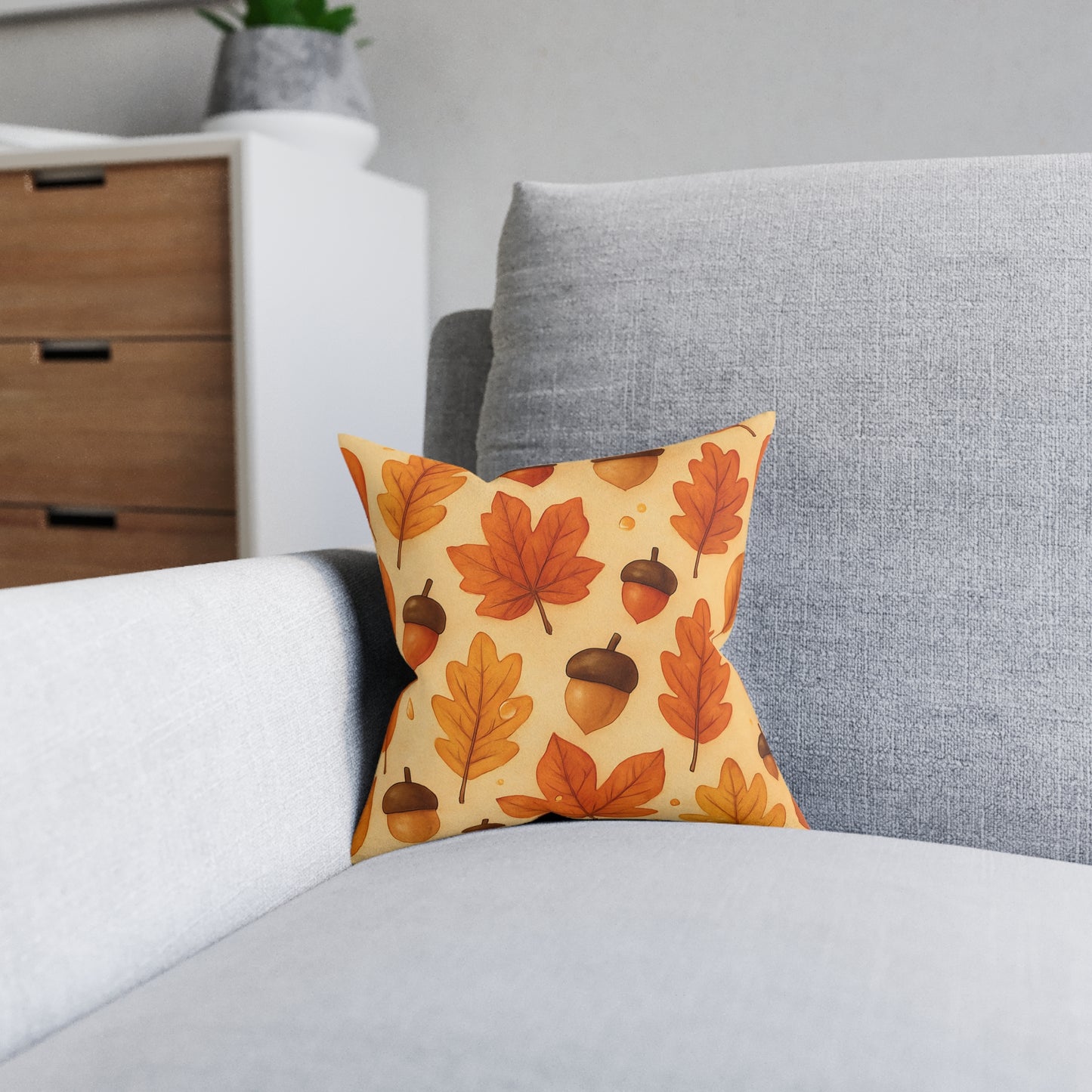 Autumnal Leaf Acorn Pillow, A tapestry of rich golden hues and crisp details, this autumn leaves pillow captures the essence of a forest carpeted with leaves, softening your space with its warm charm.