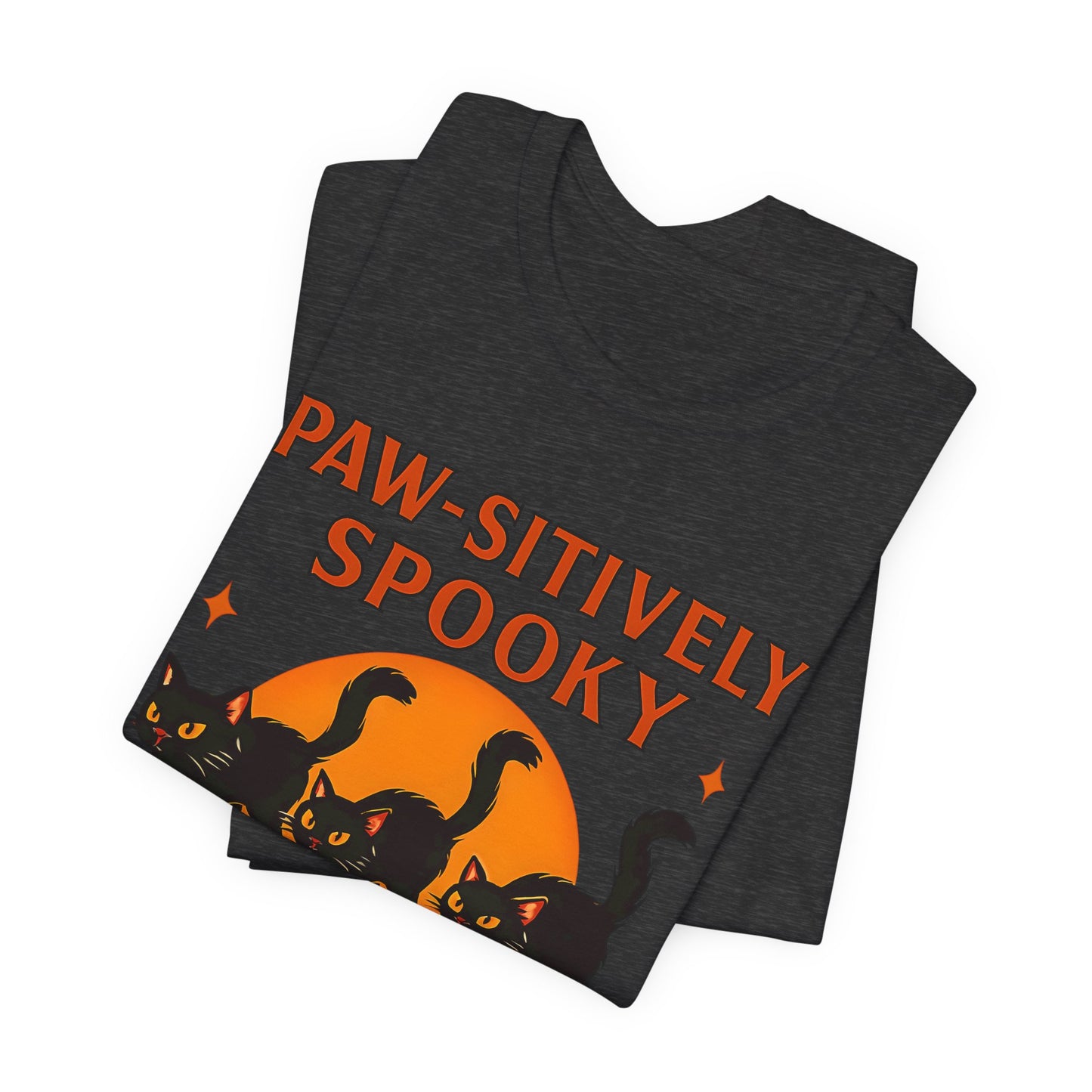 Paw-sitively Spooky Cat Tshirt, Whether you're a devoted cat dad or gifting it to a feline-loving friend, this cute Halloween cat apparel spreads pawsitive vibes with its blend of spooky black cats and cheeky charm.