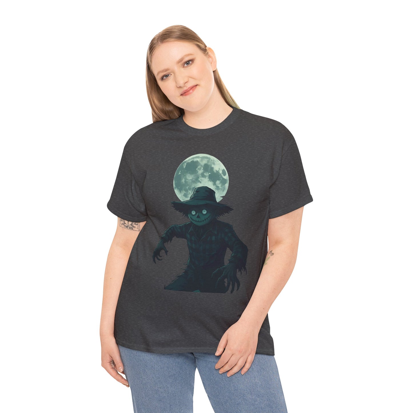 Halloween Scarecrow T-Shirt, This scarecrow shirt captures the essence of the season, transforming the traditional harvest icon into a pumpkin scarecrow that’s both captivating and chilling.Halloween