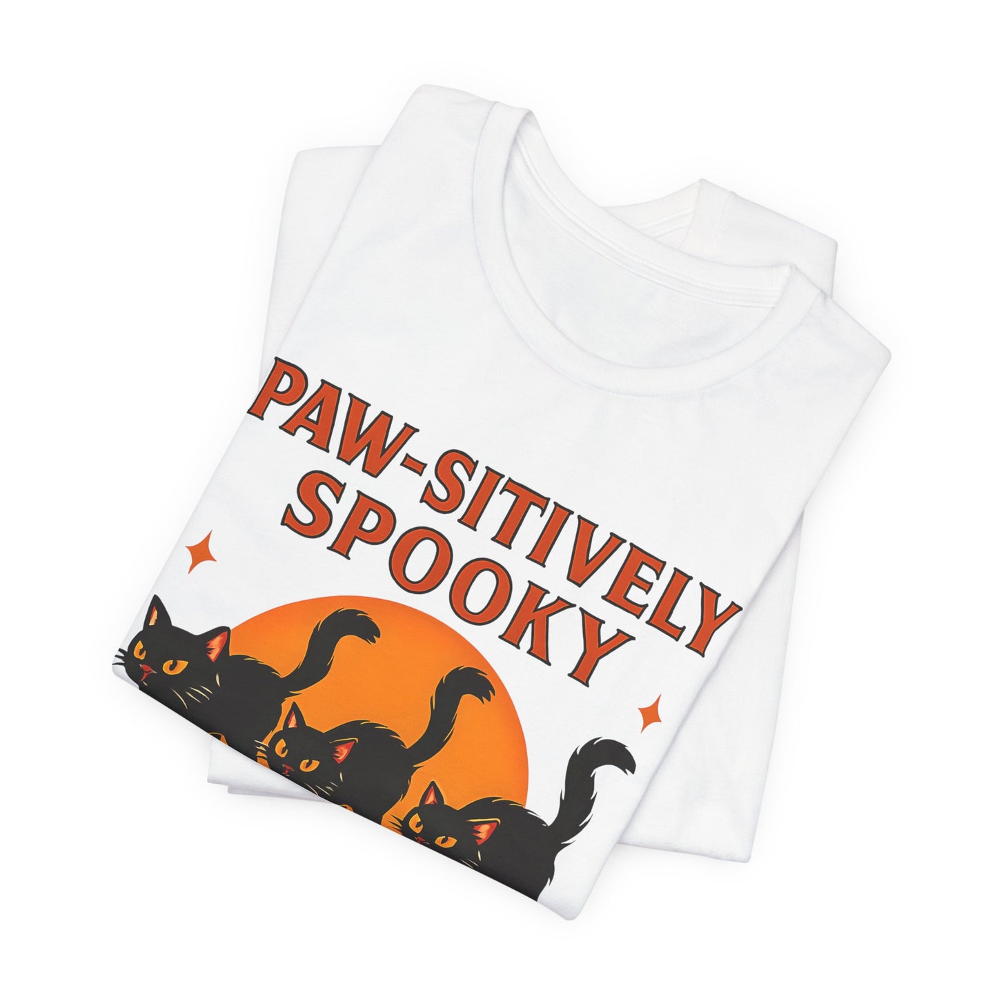 Paw-sitively Spooky Cat Tshirt, Whether you're a devoted cat dad or gifting it to a feline-loving friend, this cute Halloween cat apparel spreads pawsitive vibes with its blend of spooky black cats and cheeky charm.