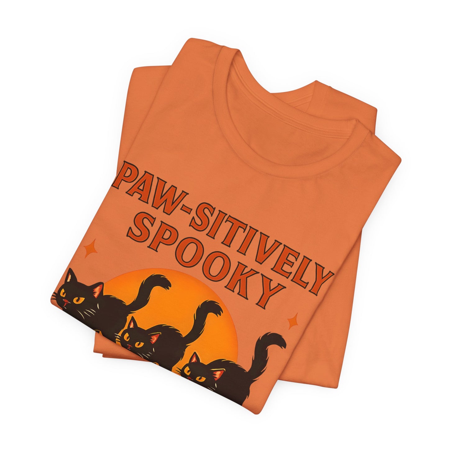 Paw-sitively Spooky Cat Tshirt, Whether you're a devoted cat dad or gifting it to a feline-loving friend, this cute Halloween cat apparel spreads pawsitive vibes with its blend of spooky black cats and cheeky charm.