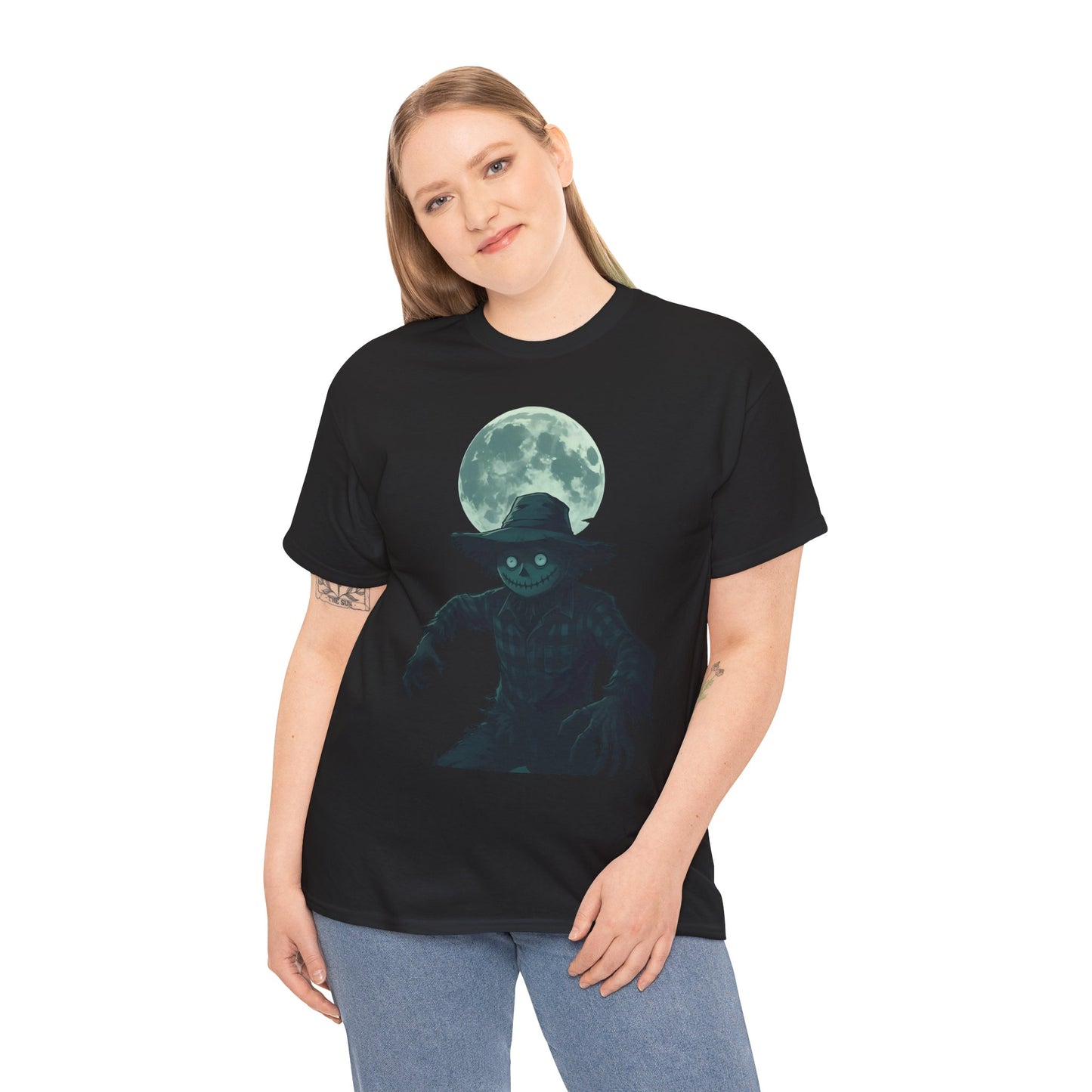 Halloween Scarecrow T-Shirt, This scarecrow shirt captures the essence of the season, transforming the traditional harvest icon into a pumpkin scarecrow that’s both captivating and chilling.Halloween