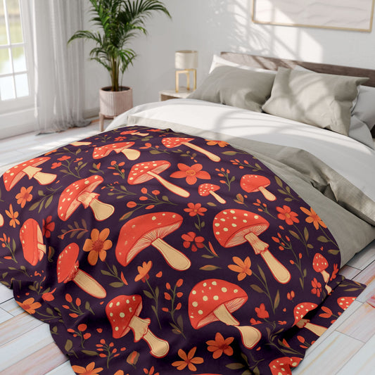 Cozy Mushroom Blanket, The enchanting mushroom pattern, set against a rich plum throw, turns any sofa into an autumnal paradise.