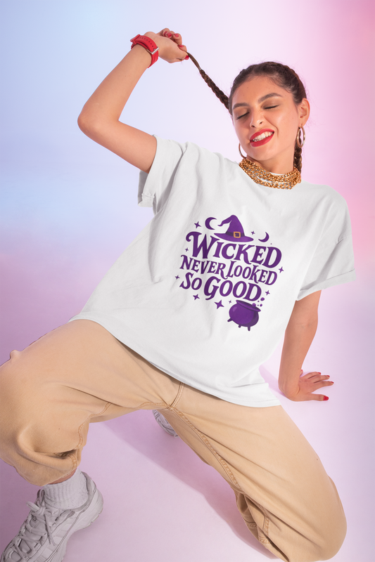 Wicked Never Looked So Good T-Shirt, a spellbinding addition to any witchy wardrobe, embodying the mischievous charm of witchcraft.