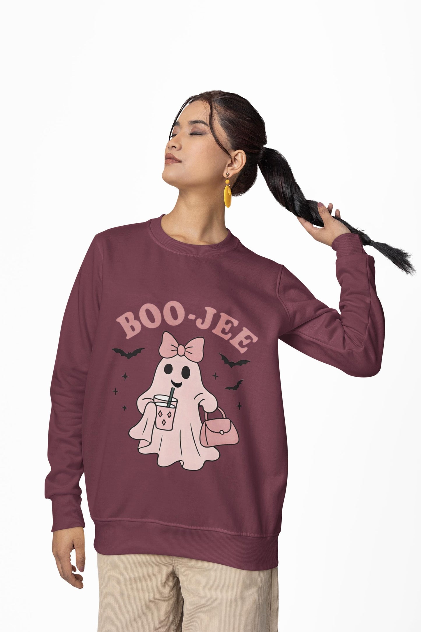 Boo-Jee Ghost Sweatshirt This playful garment, affectionately known as the boojee sweater, showcases charming ghosties adorned with a delightful pink bow.