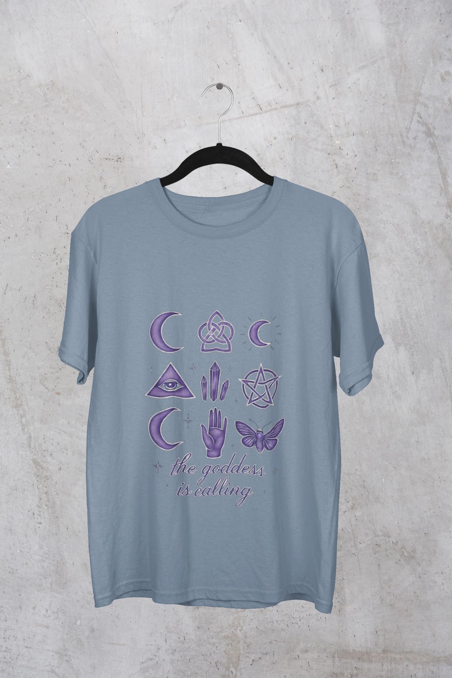 The Goddess is Calling Shirt, a celebration of divine feminine energy, seamlessly blending style and spirituality.