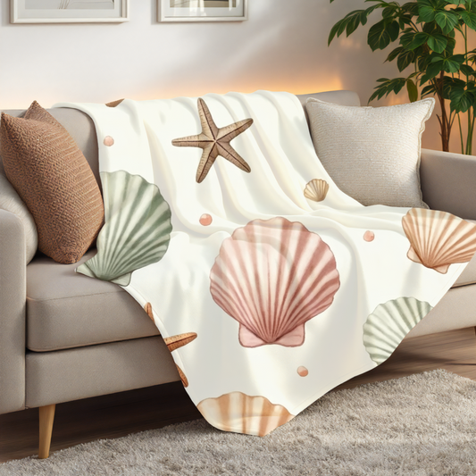 Cozy Beach-Themed Fleece Blanket, Featuring a delightful seashell design, it brings a touch of oceanic beauty to any space.