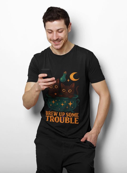 Brew Up Some Trouble Cat Witchy T-shirt, The seamless blend of mystical charm and humor makes this shirt a must-have for any lover of cute Halloween cat apparel.