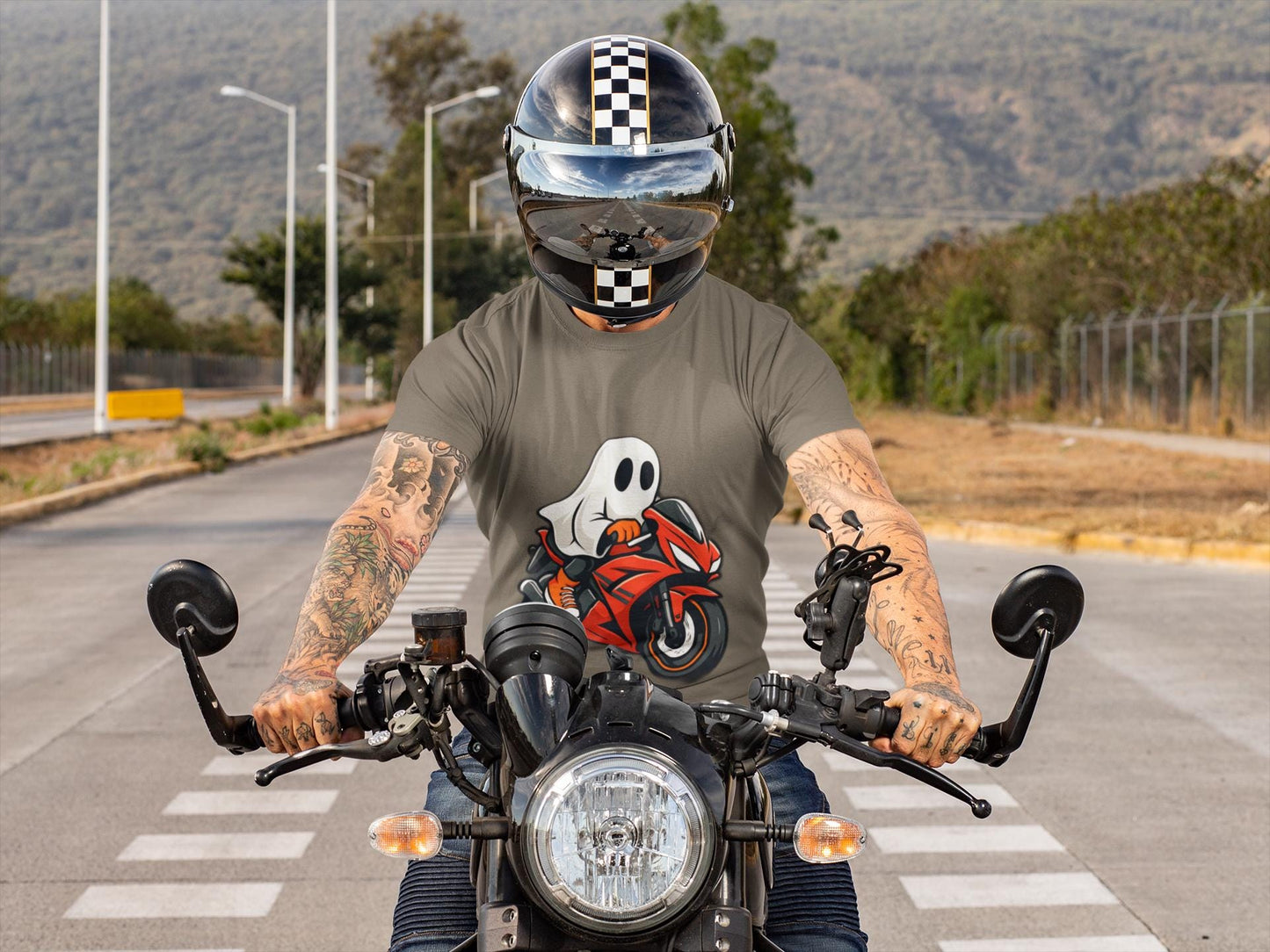 Ghosty Biker T-shirt, This ghost rider shirt captures the essence of Halloween with its hauntingly cool design, making it an essential piece for motorcycle enthusiasts who crave a dose of the supernatural.