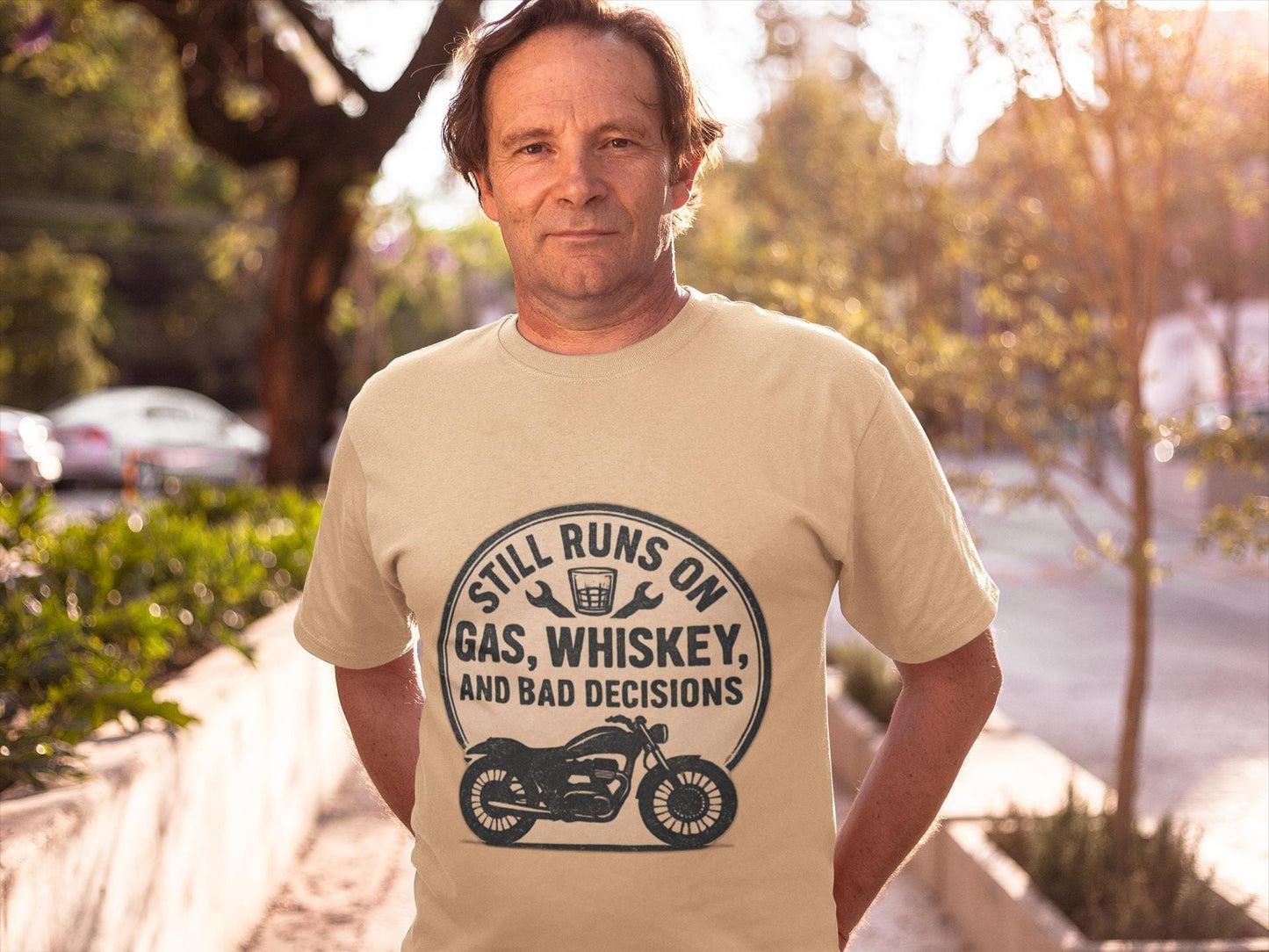 Still Runs On Gas Whiskey And Bad Decisions Shirt, This motorcycle tee blends humor with style, making it an essential addition to any biker's wardrobe.