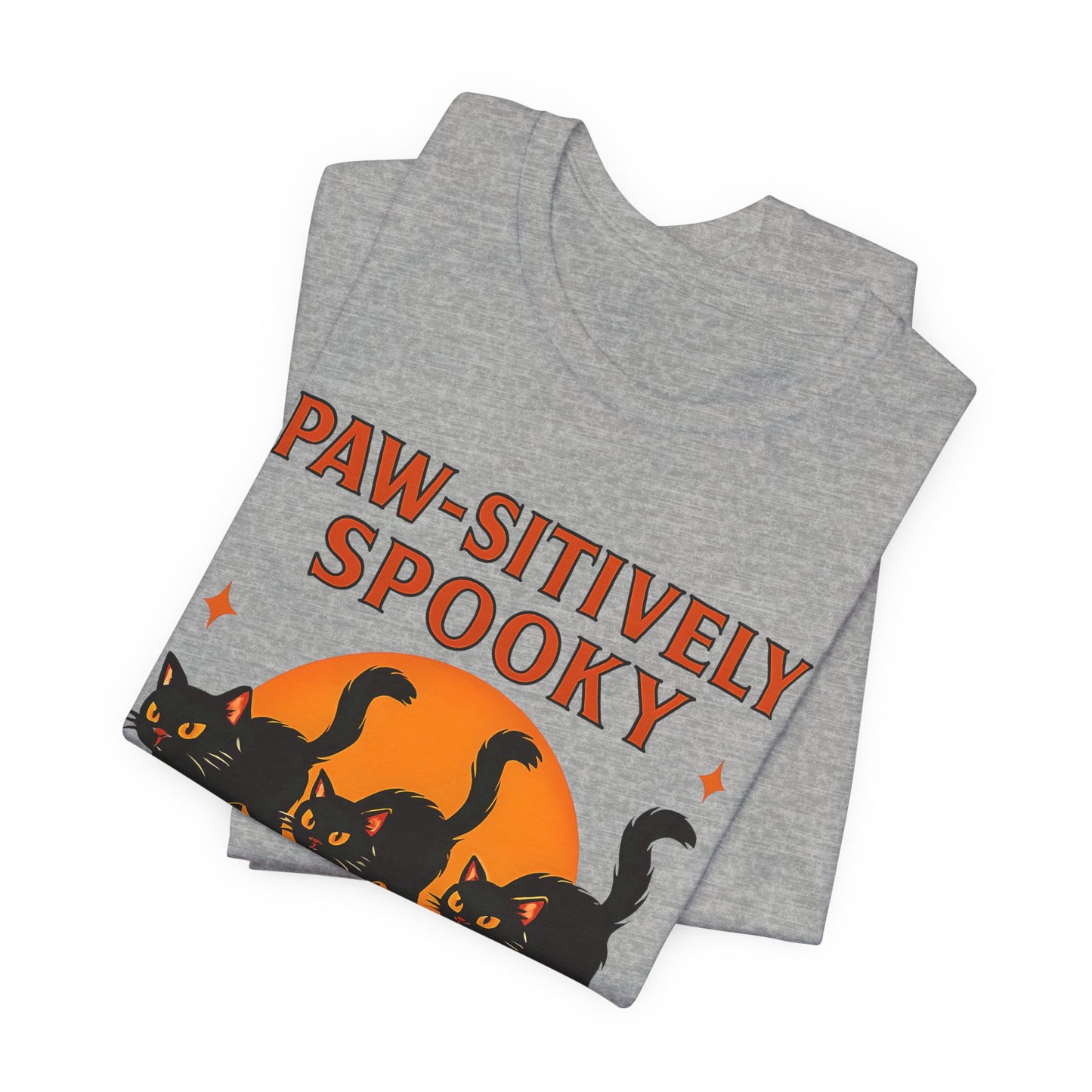 Paw-sitively Spooky Cat Tshirt, Whether you're a devoted cat dad or gifting it to a feline-loving friend, this cute Halloween cat apparel spreads pawsitive vibes with its blend of spooky black cats and cheeky charm.