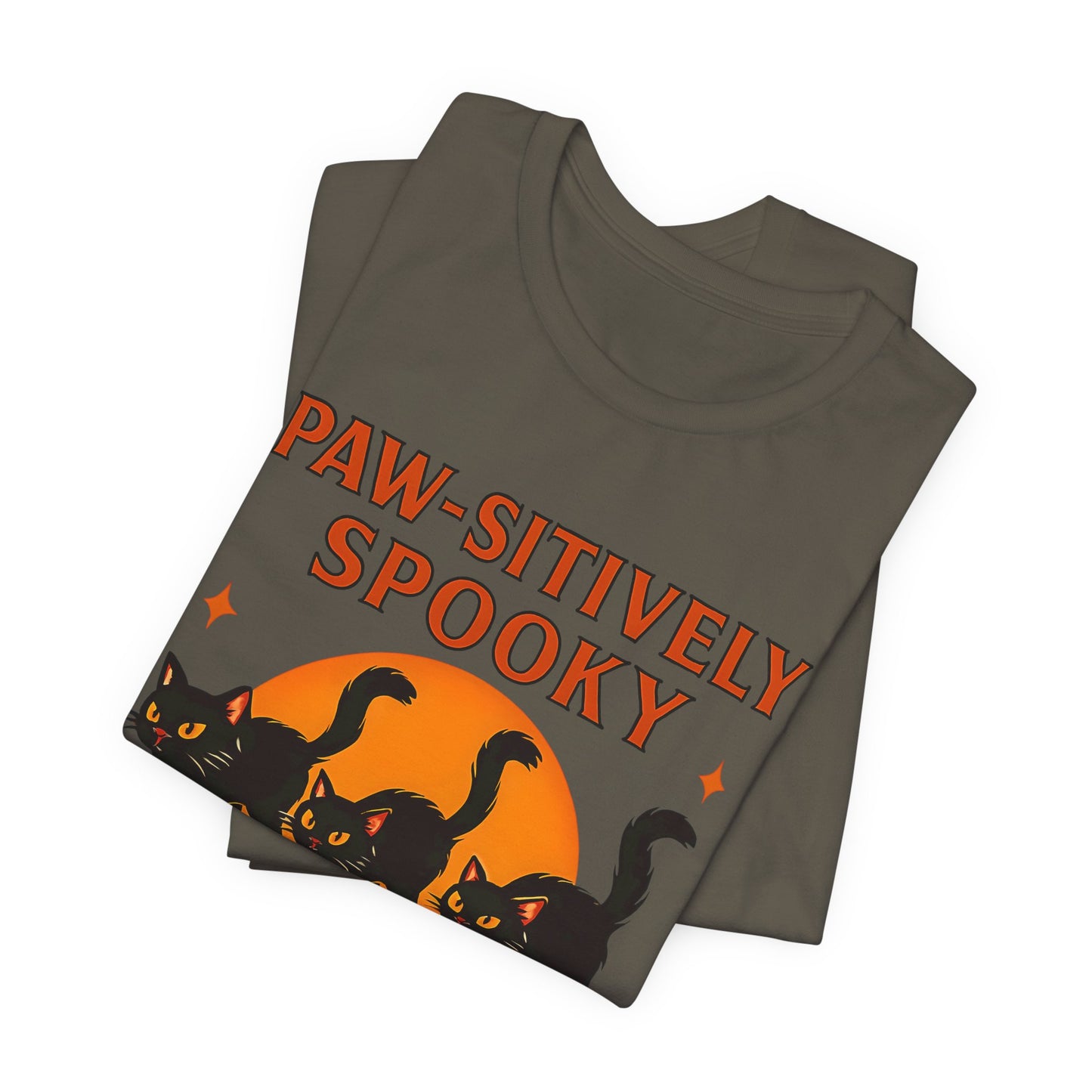 Paw-sitively Spooky Cat Tshirt, Whether you're a devoted cat dad or gifting it to a feline-loving friend, this cute Halloween cat apparel spreads pawsitive vibes with its blend of spooky black cats and cheeky charm.